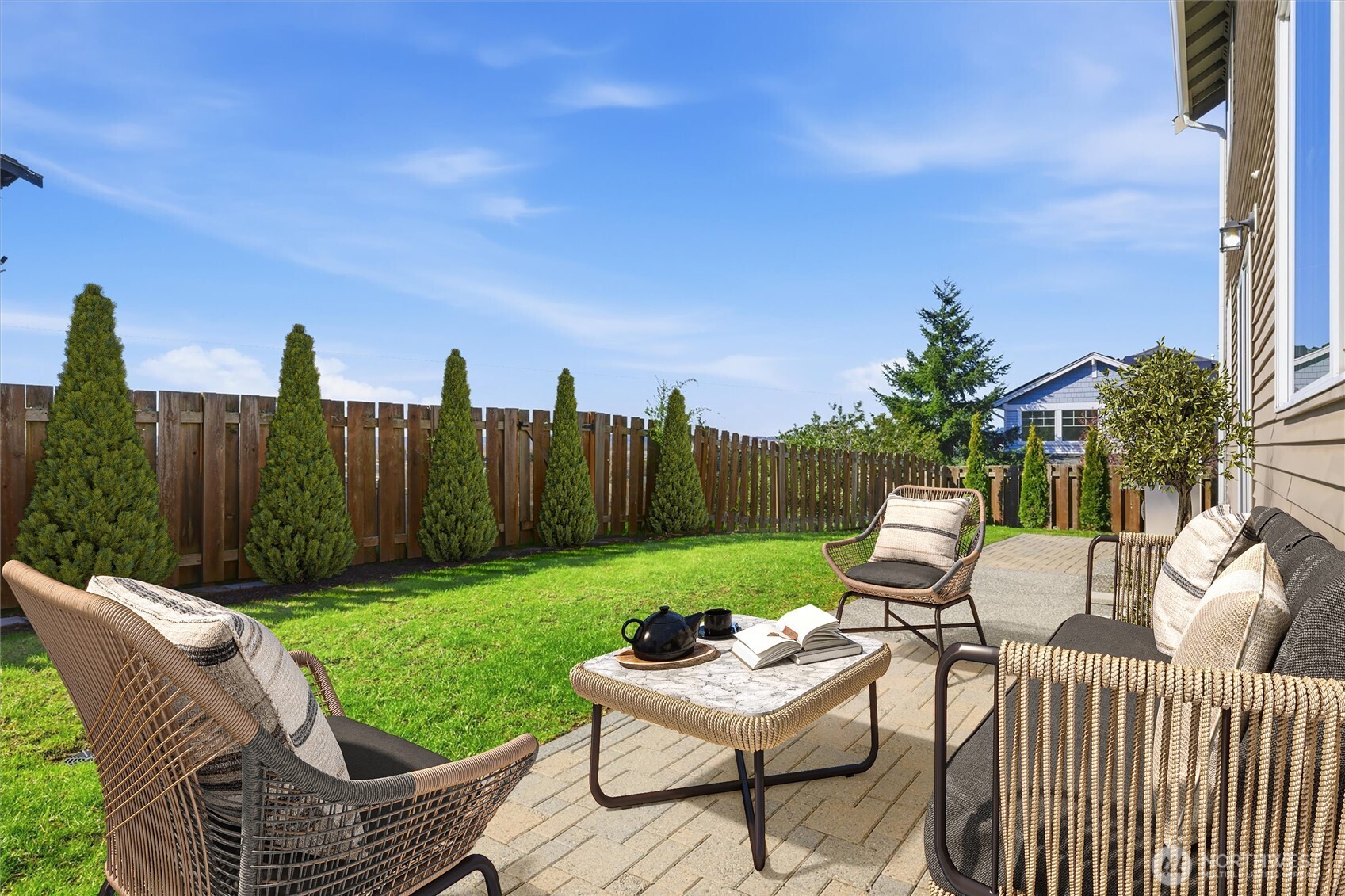 Patio in fully fenced backyard (virtually staged)