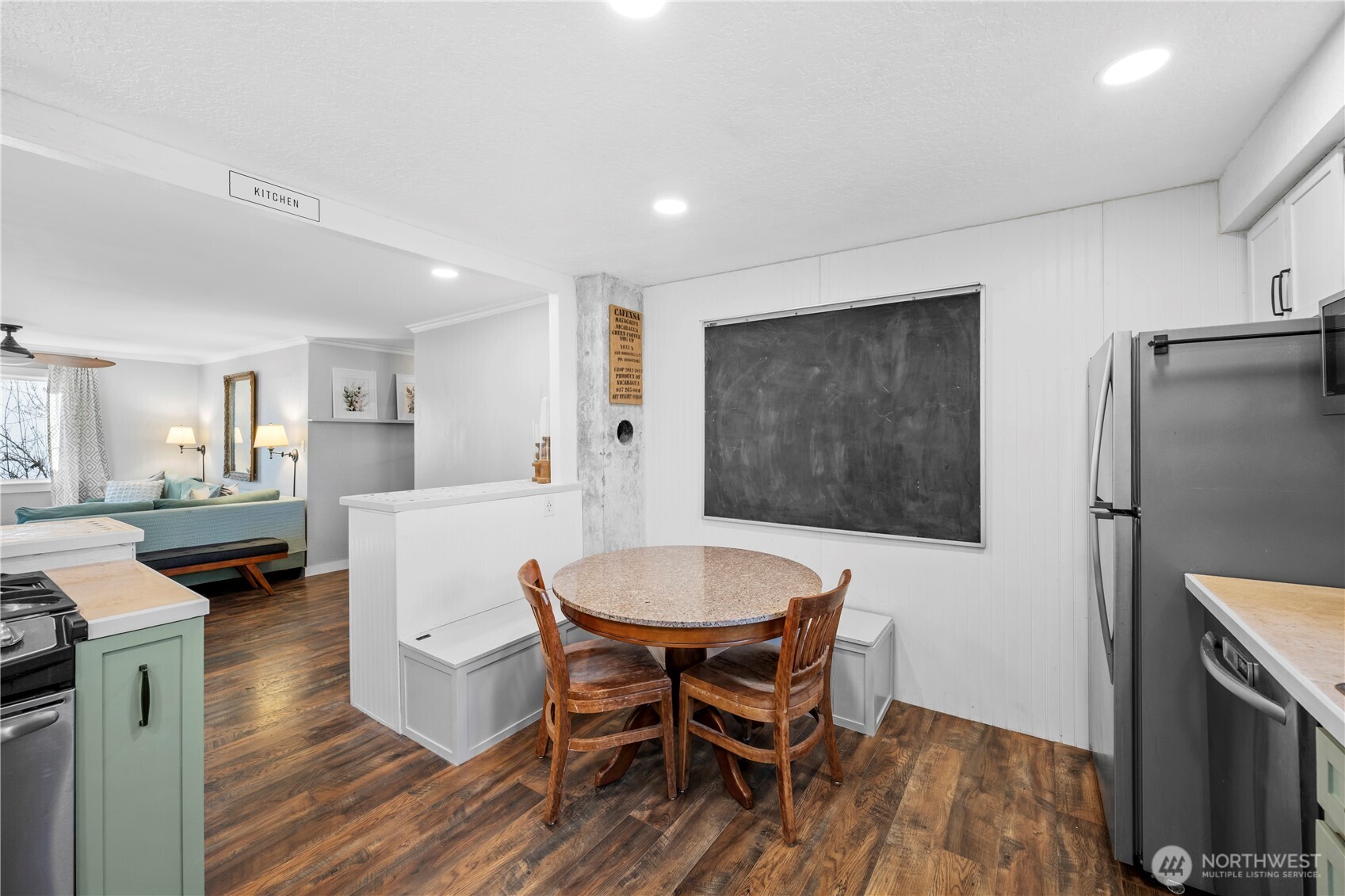 Cozy built-in kitchen bench and chalkboard wall perfect for notes, menus, or creativity.