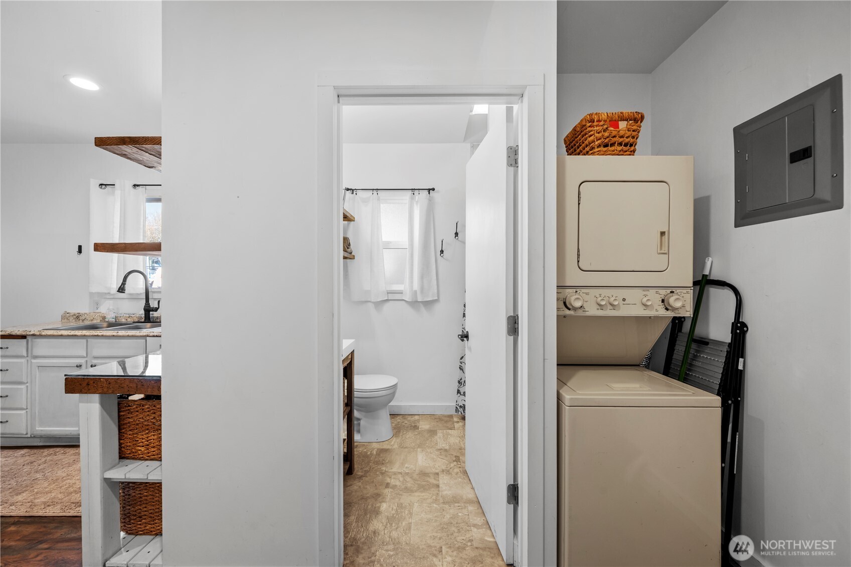 Bathroom with Shower and convenient laundry space.