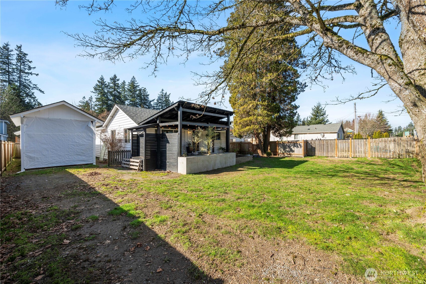 Double gate that opens for access to the large freshly painted covered Carport for RV, Boat, Toys or more. Large shed is situated right behind for great storage!