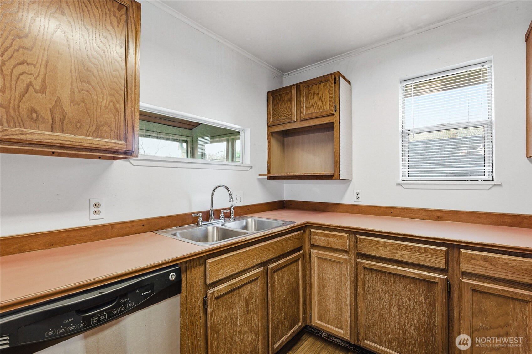 Expansive, level backyard with plenty of room for gardening, pets, and play. The added bonus? This space is a future goldmine—the rare alley access and zoning allow for additional dwellings down the road. Buy for the yard, keep for the potential.