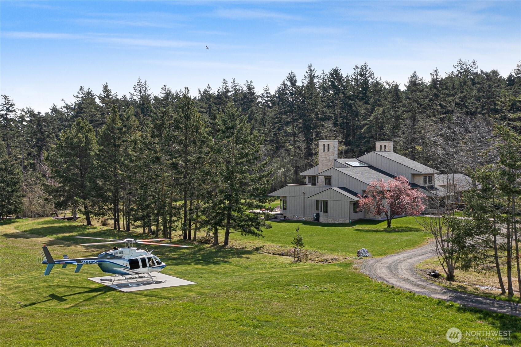 Private FAA-certified 2,400± ft airstrip with helipad adjacent to the 8,674± sq ft luxury estate, offering seamless fly-in access and end-of-road privacy on 63± acres on San Juan Island.