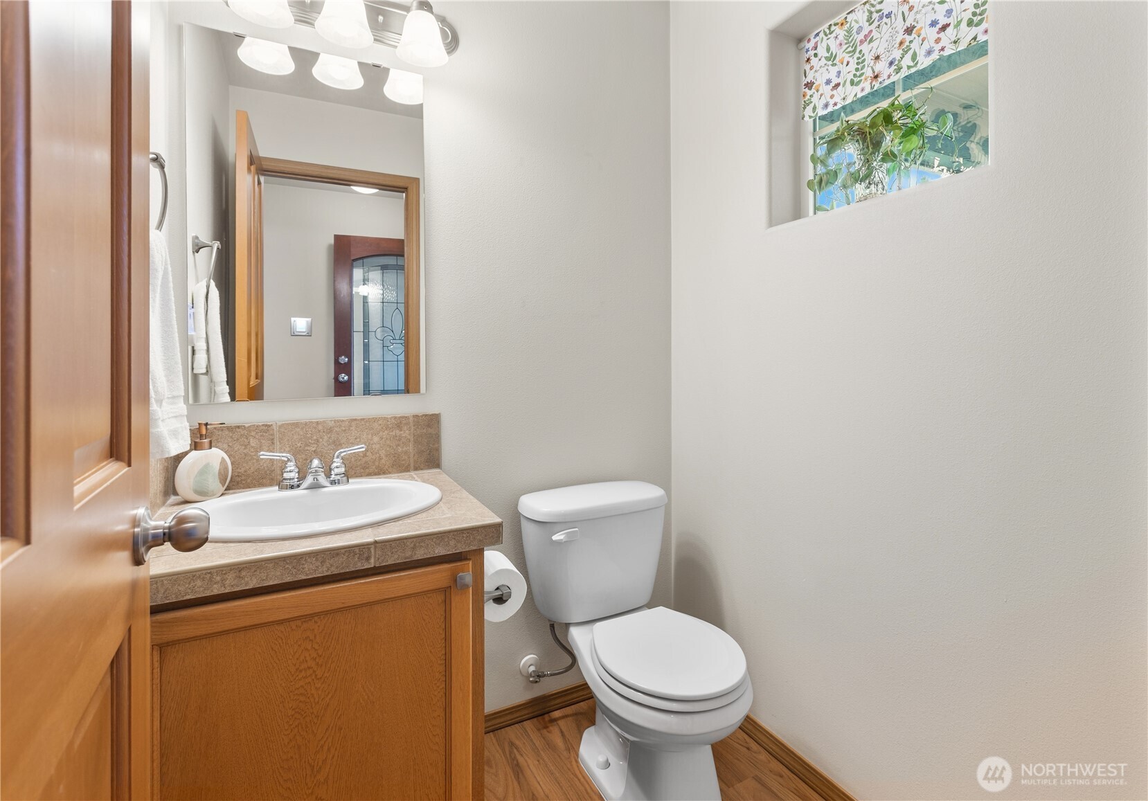 Cute half bath on main floor for your guests!