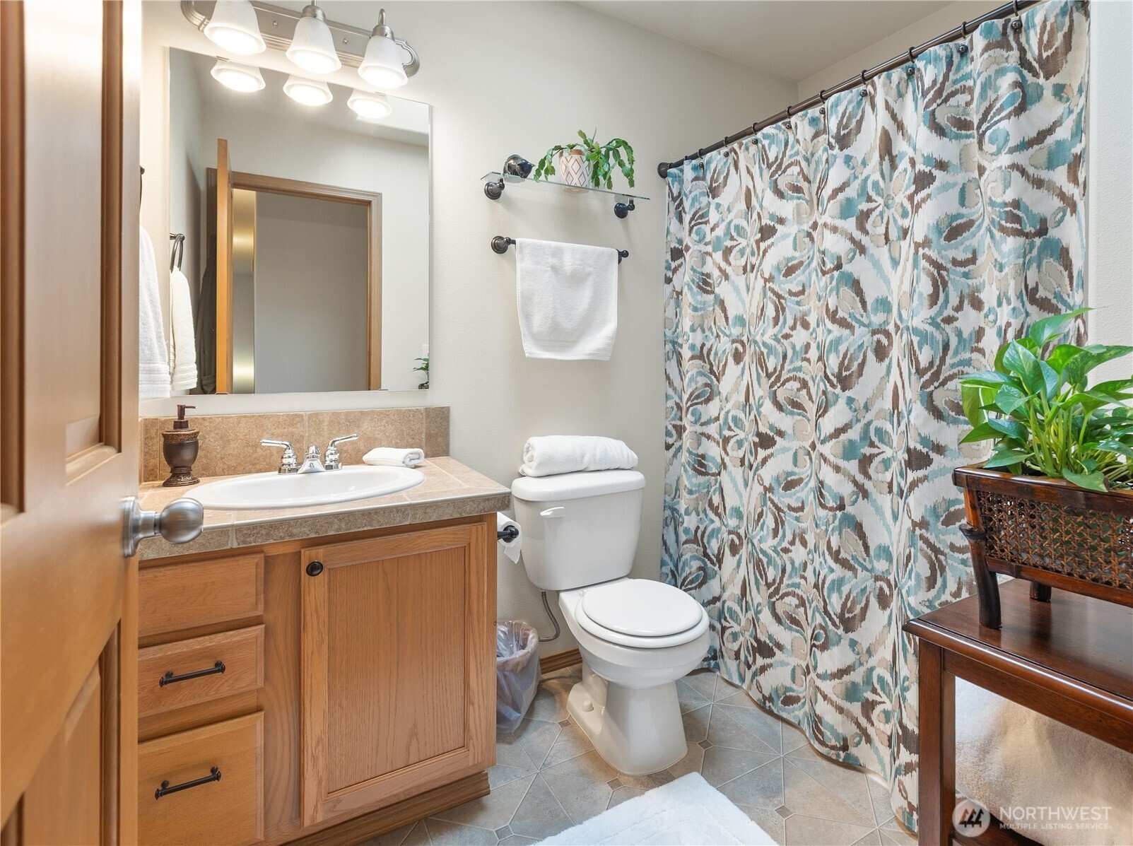 Guest bath on 2nd story offers a pretty skylight & a bathtub!