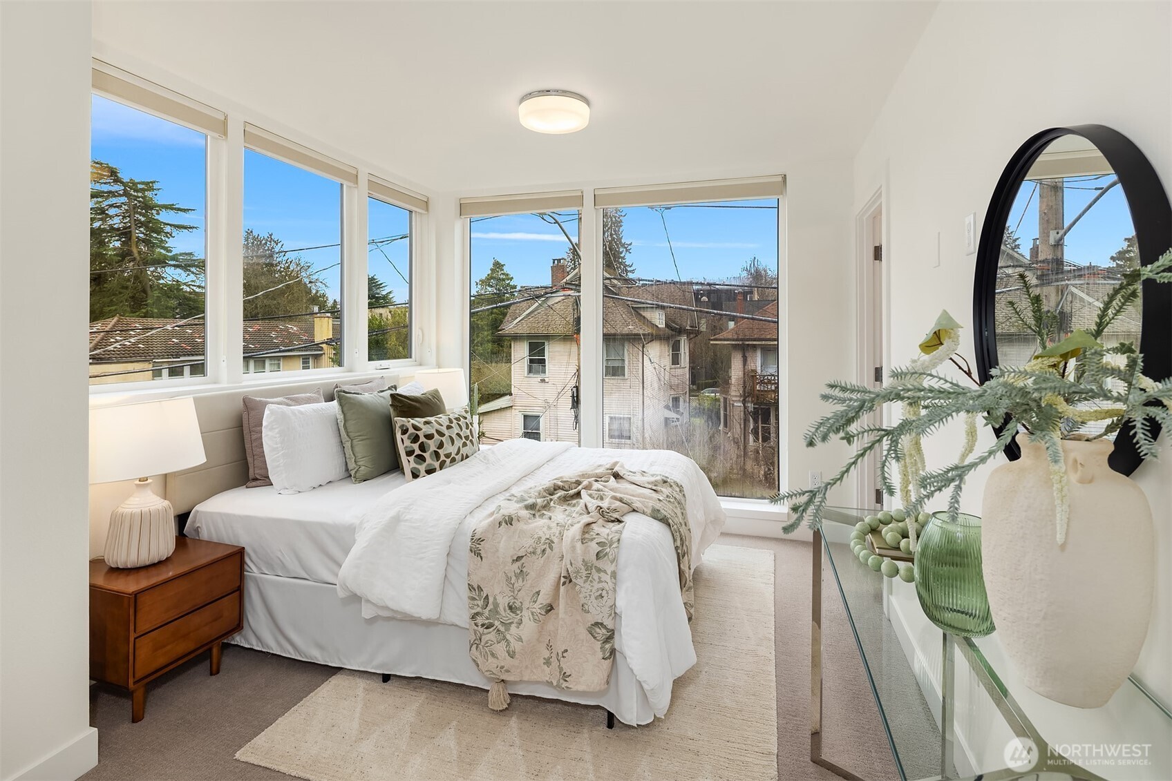 The generously sized primary bedroom on the top floor (also with en-suite bathroom) has the best light in the home.