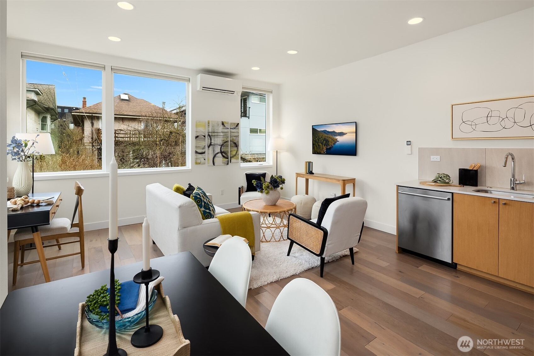 The open-plan living/dining/kitchen area on the second floor is bathed in natural light, with a flexible layout that lends itself well to different configurations.