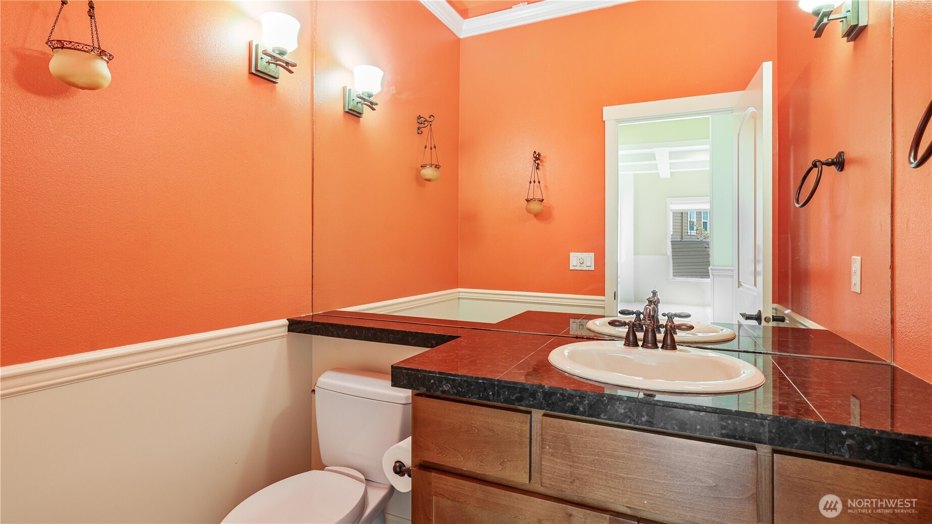 Half bath on main level boasts indirect lighting.