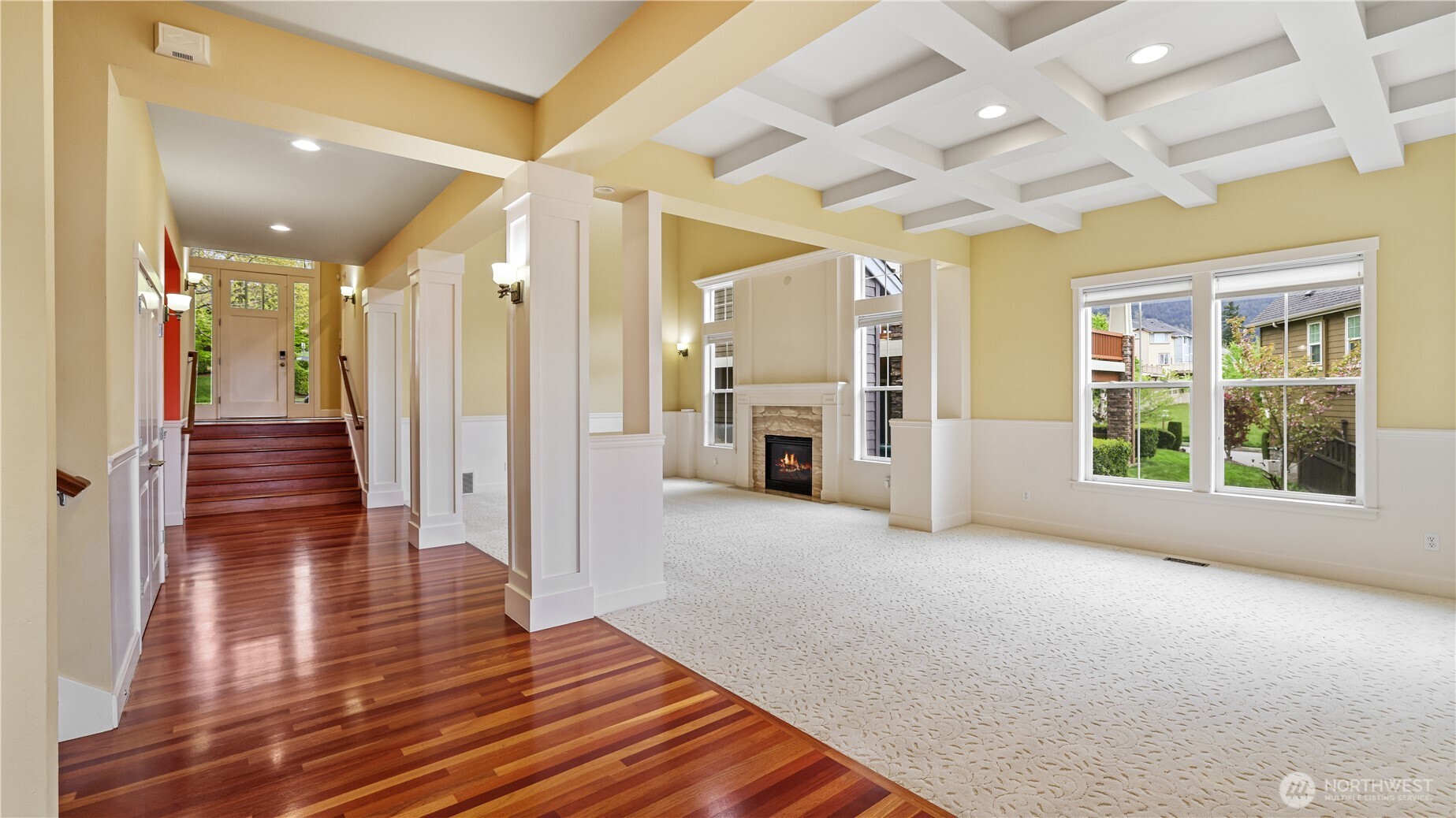 Make a grand entrance onto gleaming hardwood floors, surrounded by stunning architectural woodwork.