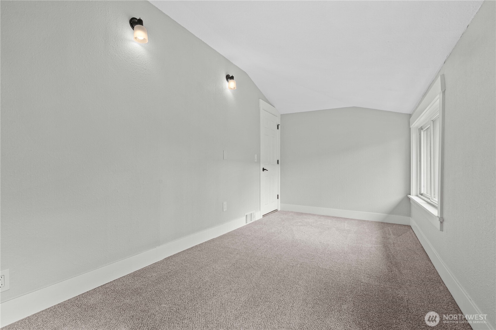 Bedroom #2 w/view of the opposite wall with sconces for unique lighting feature.