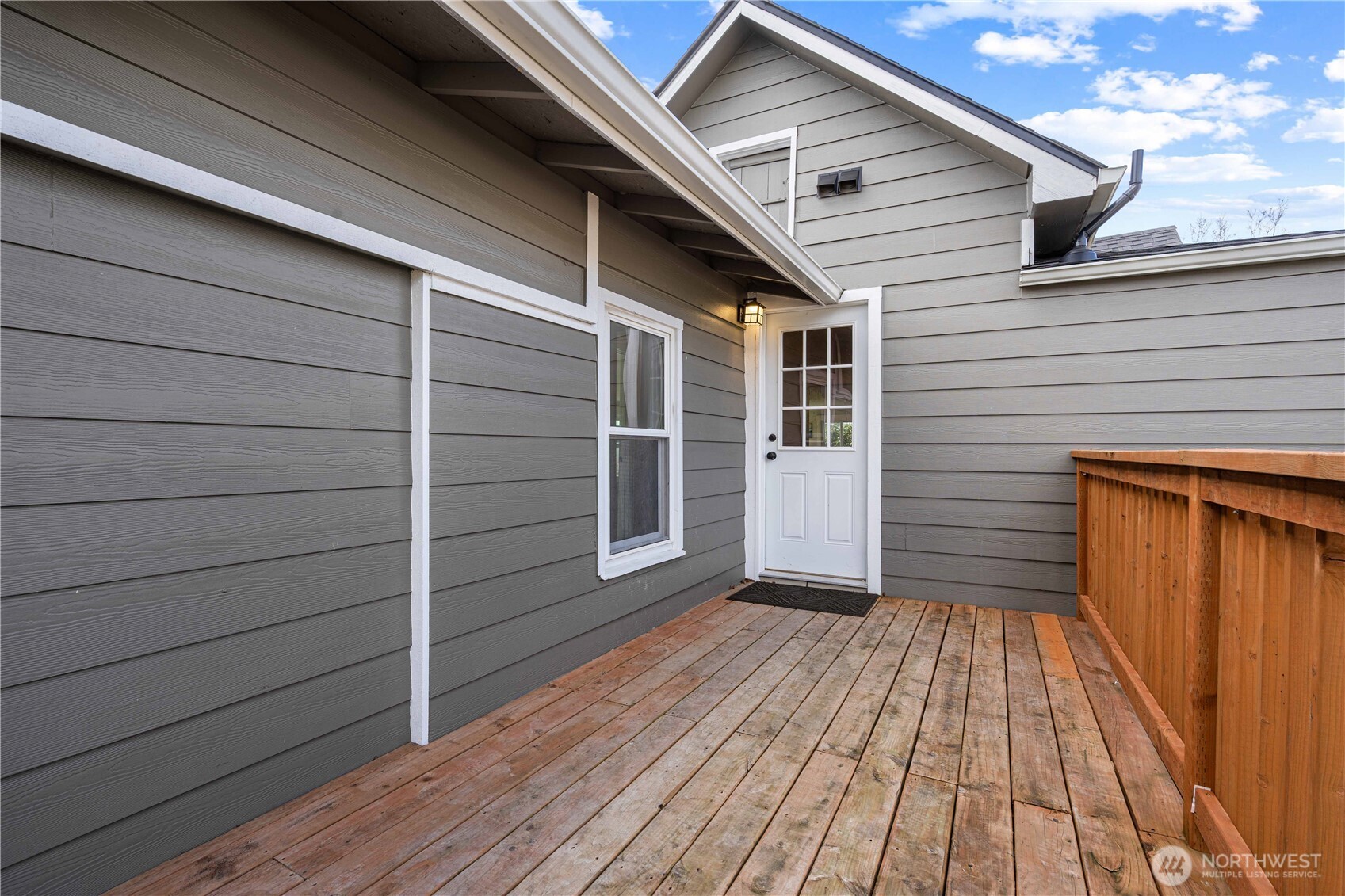 Deck off the Family Room leads to the backyard.