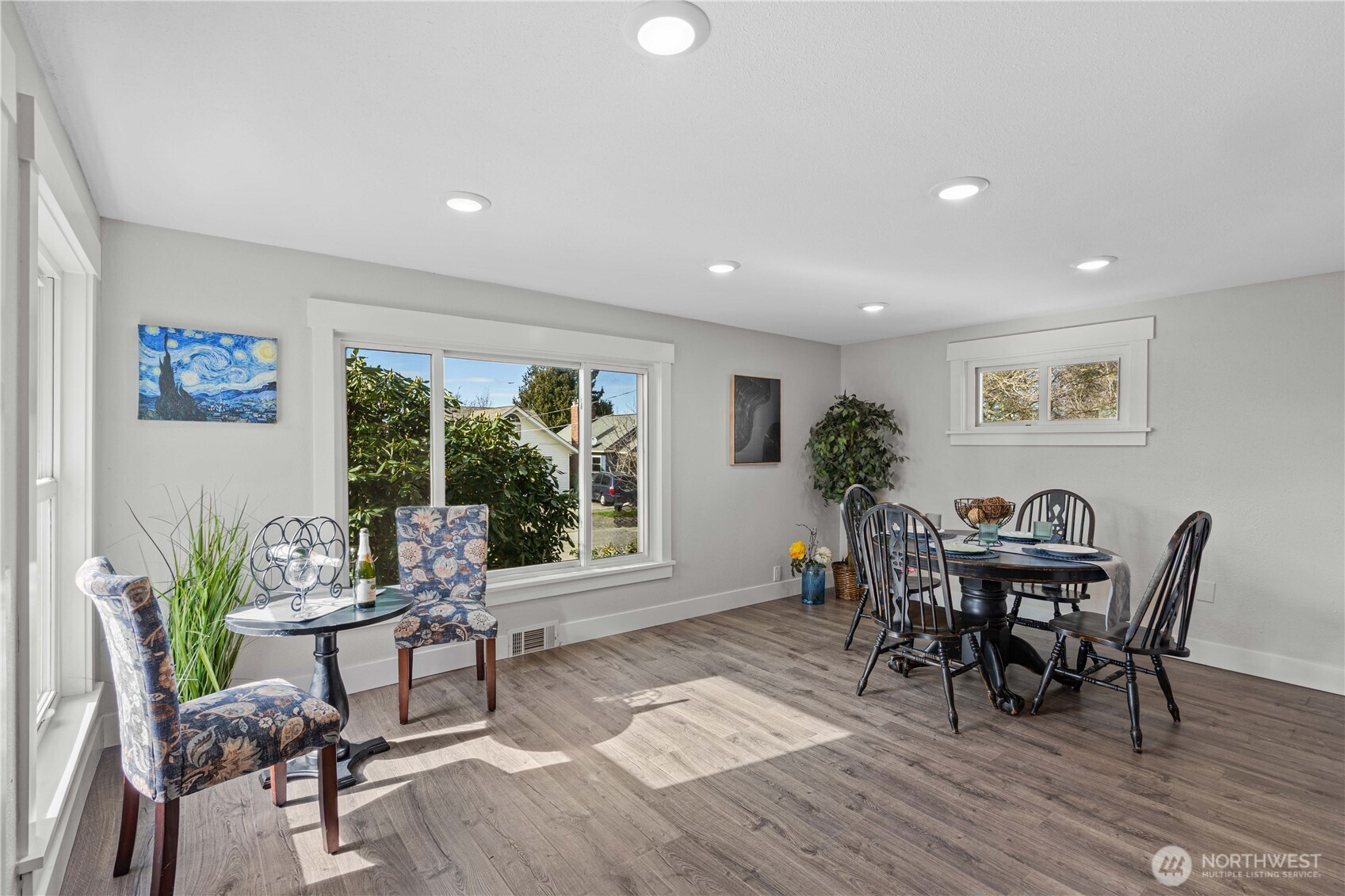 Living and Dining Rooms showing how spacious this area is. Notice the Fully Millwork Wrapped windows and recessed lighting.