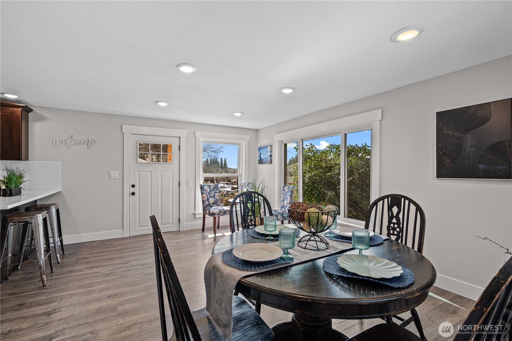 Dining and Living Rooms. Tons of Natural light fill this space.