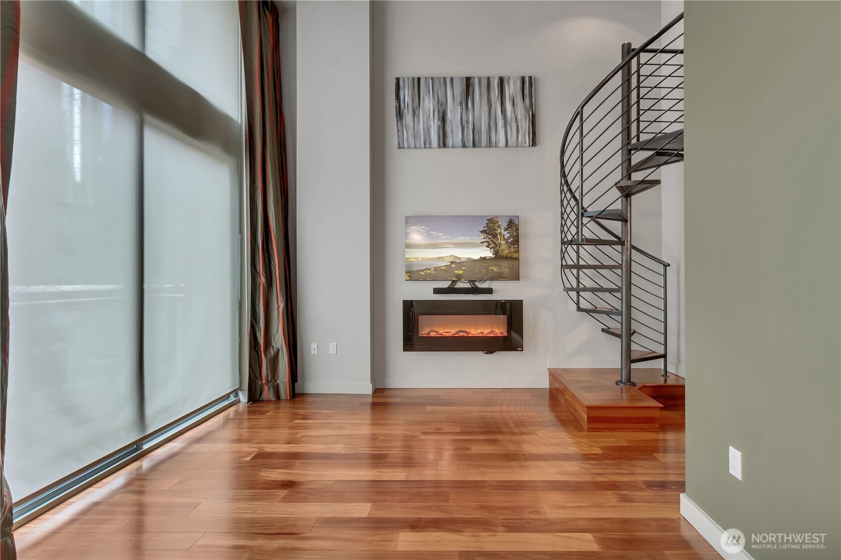 View of living room with slider to balcony.