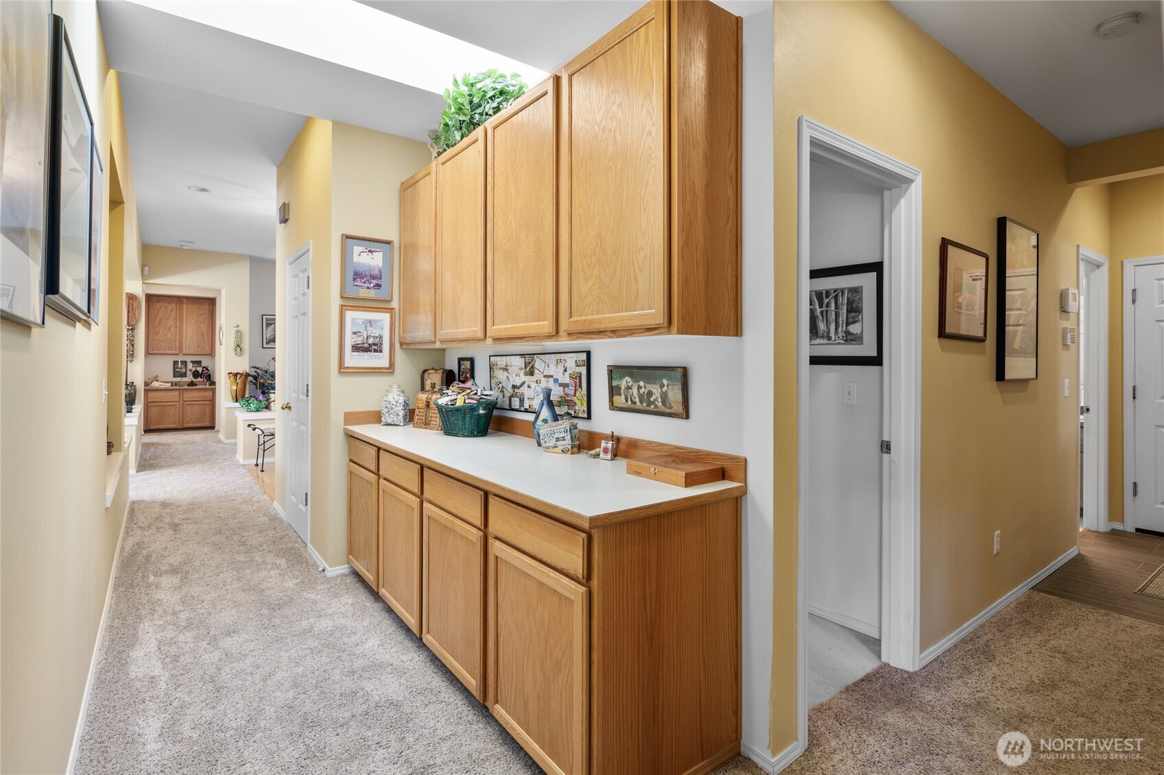 Front foyer area looking down hallway and into the living and dining room.