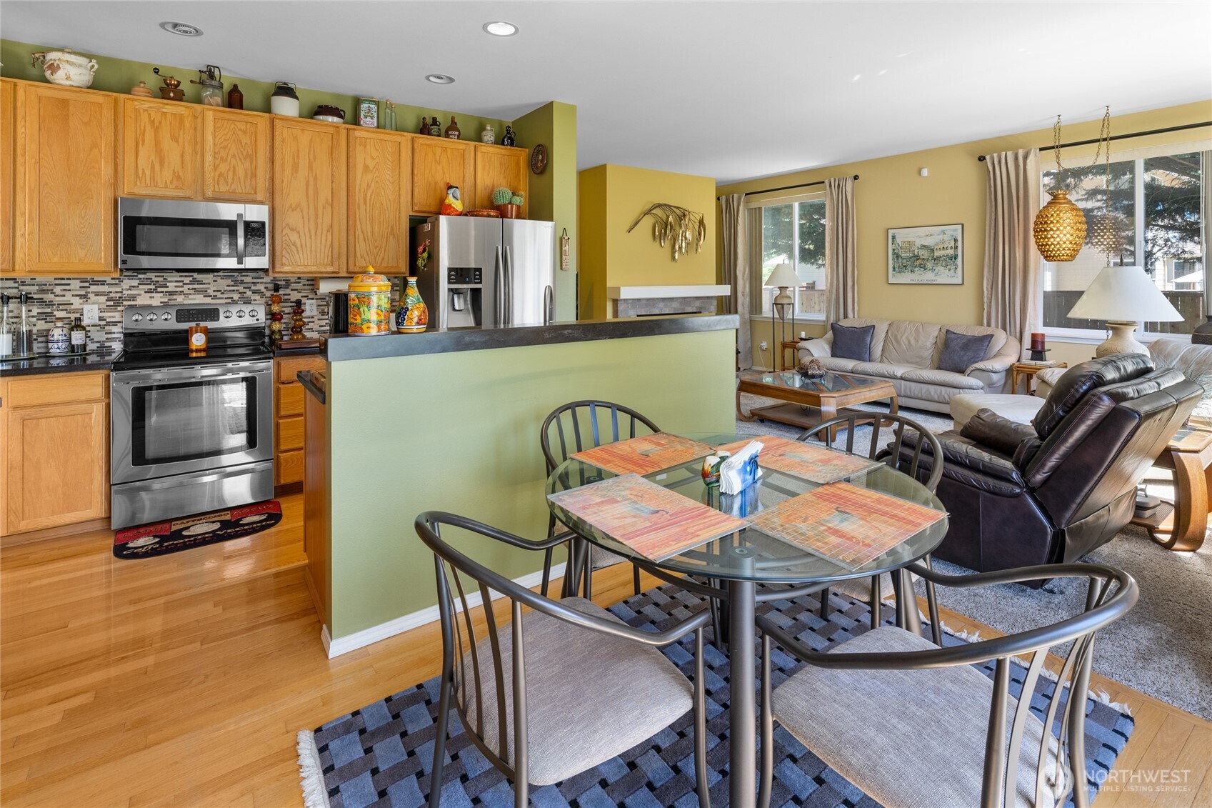 Kitchen with eating area and access out to the back patio and back yard oasis.