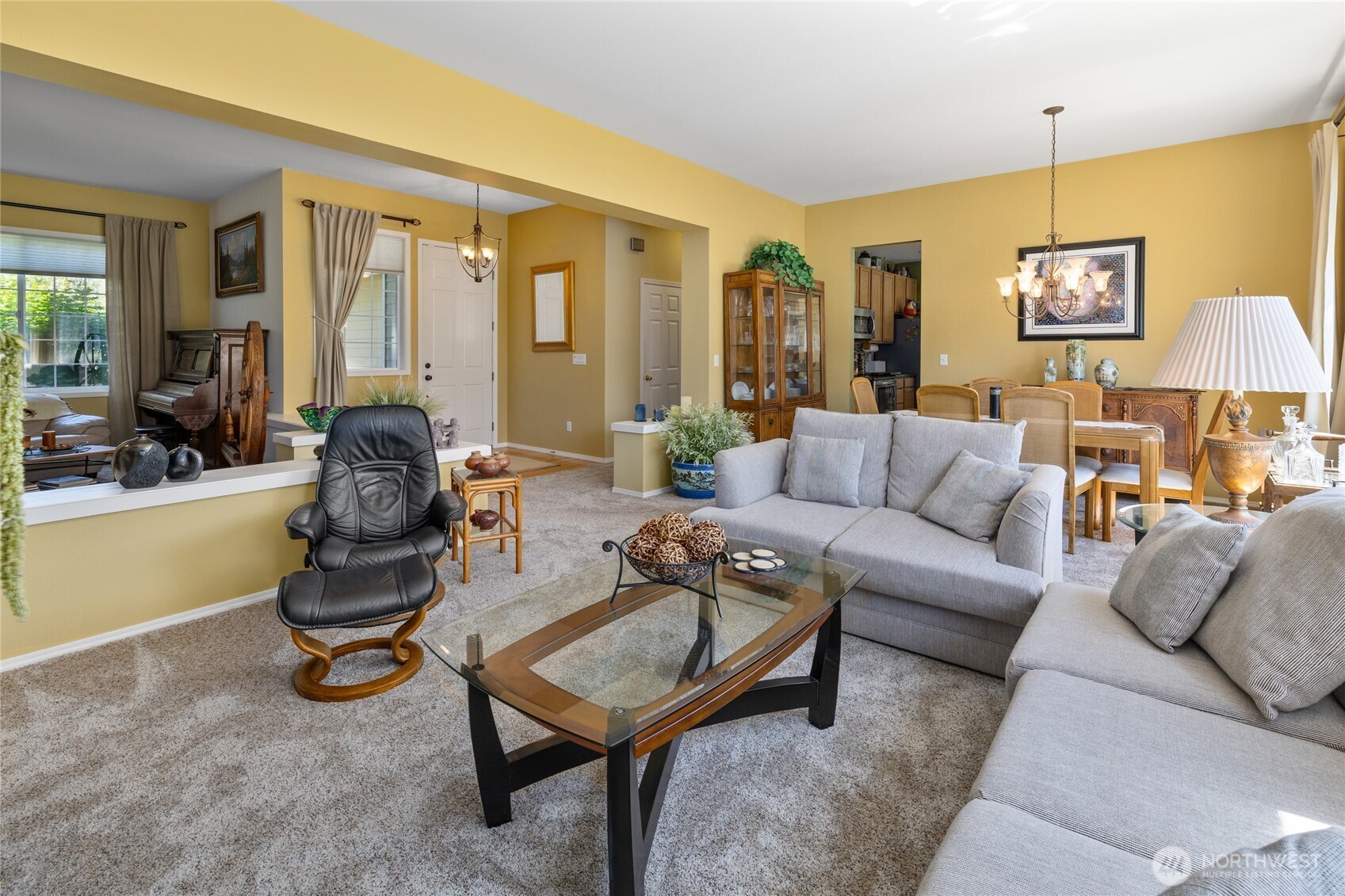 Front entry foyer looking into living room and outside to your beautifully maintained yard and view!