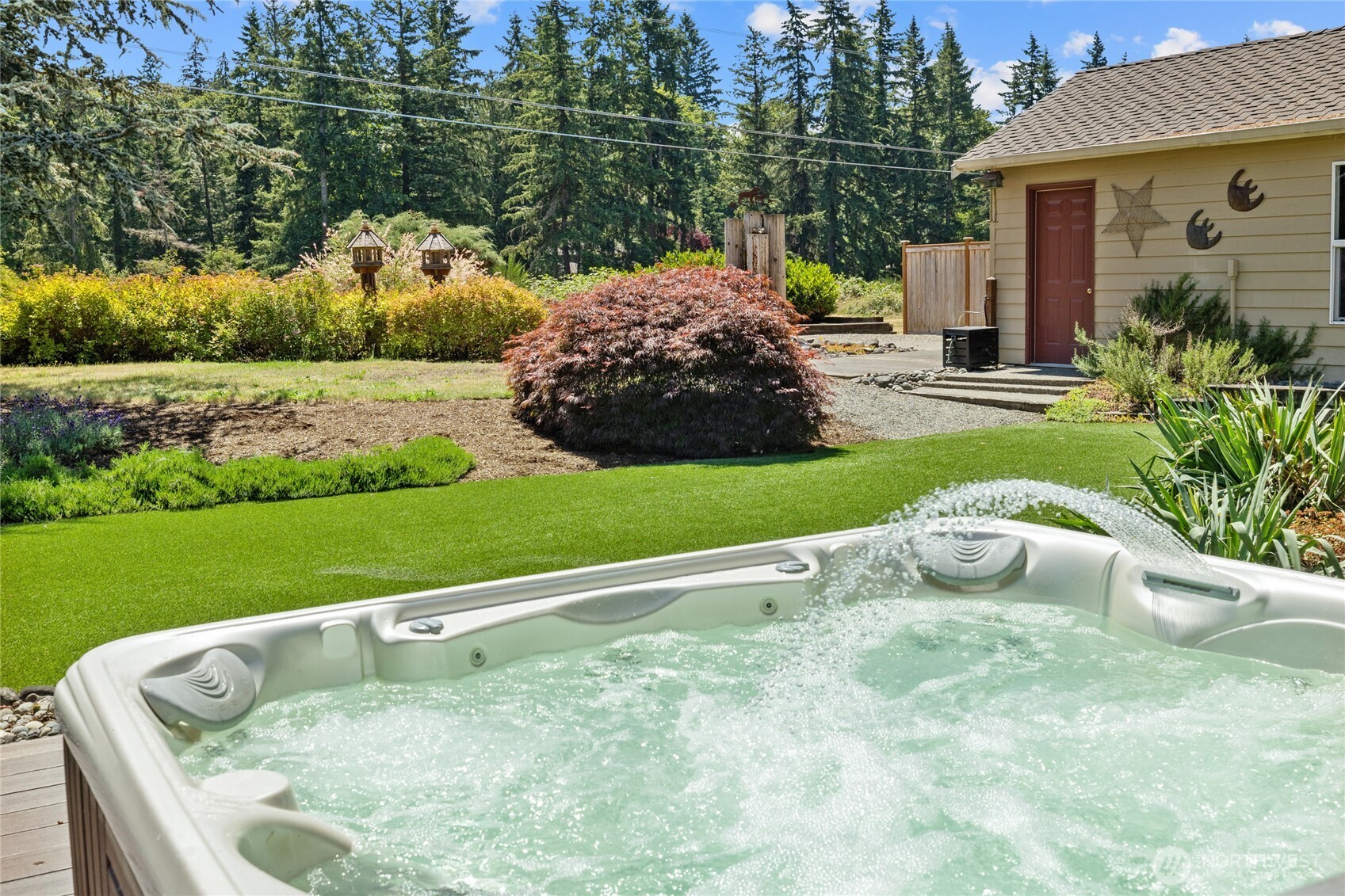 Your back yard oasis! Hot Tub, LARGE aggregate patio area and turf yard plus extra large storage shed with water and power!!!!