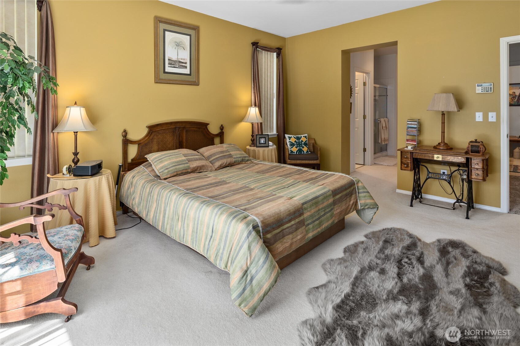 Primary bedroom with private back yard patio area.