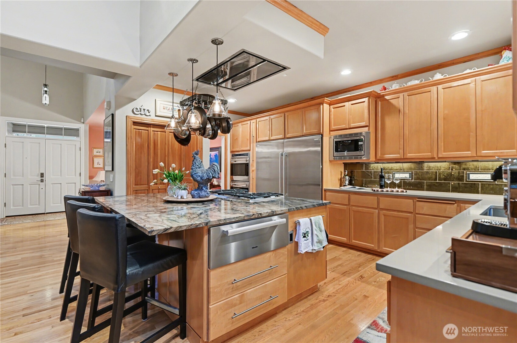 Spacious & functional island with cooktop and storage provides the ideal spot for quick meals and entertaining.