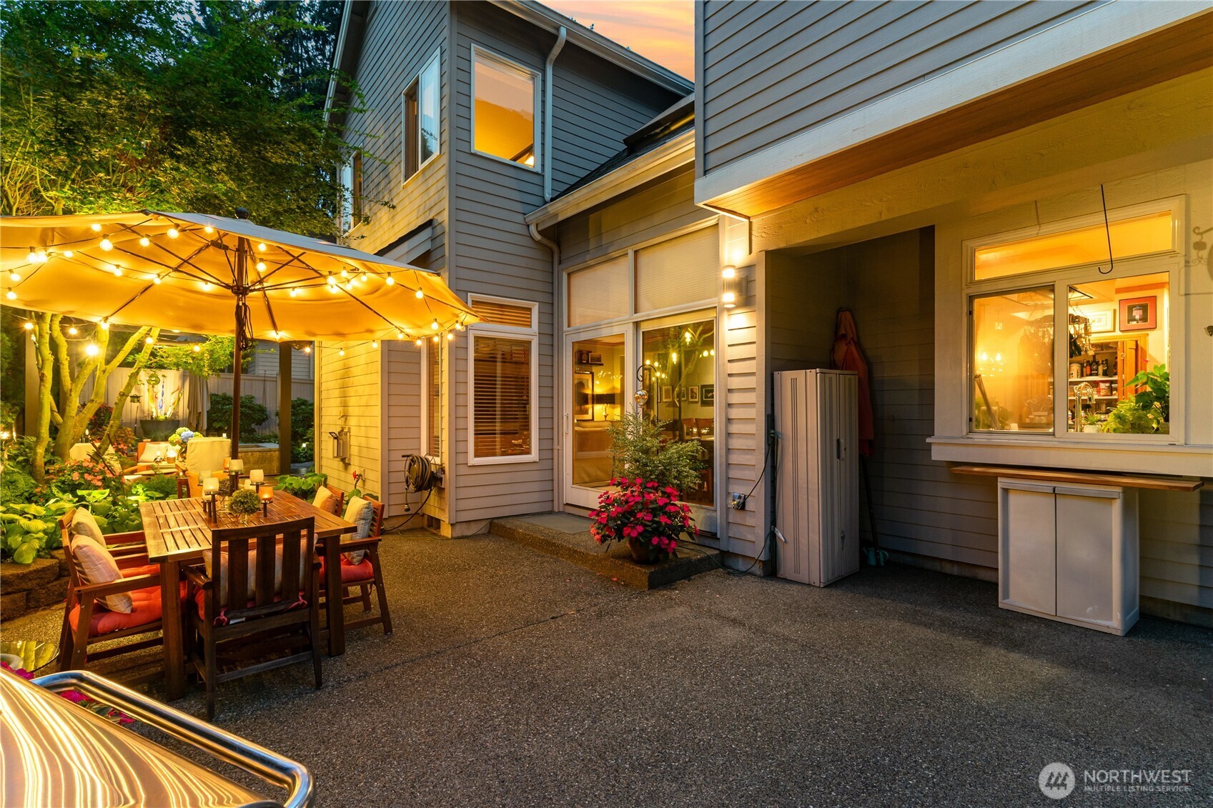 Enjoy relaxing evenings in this beautifully lit backyard oasis.