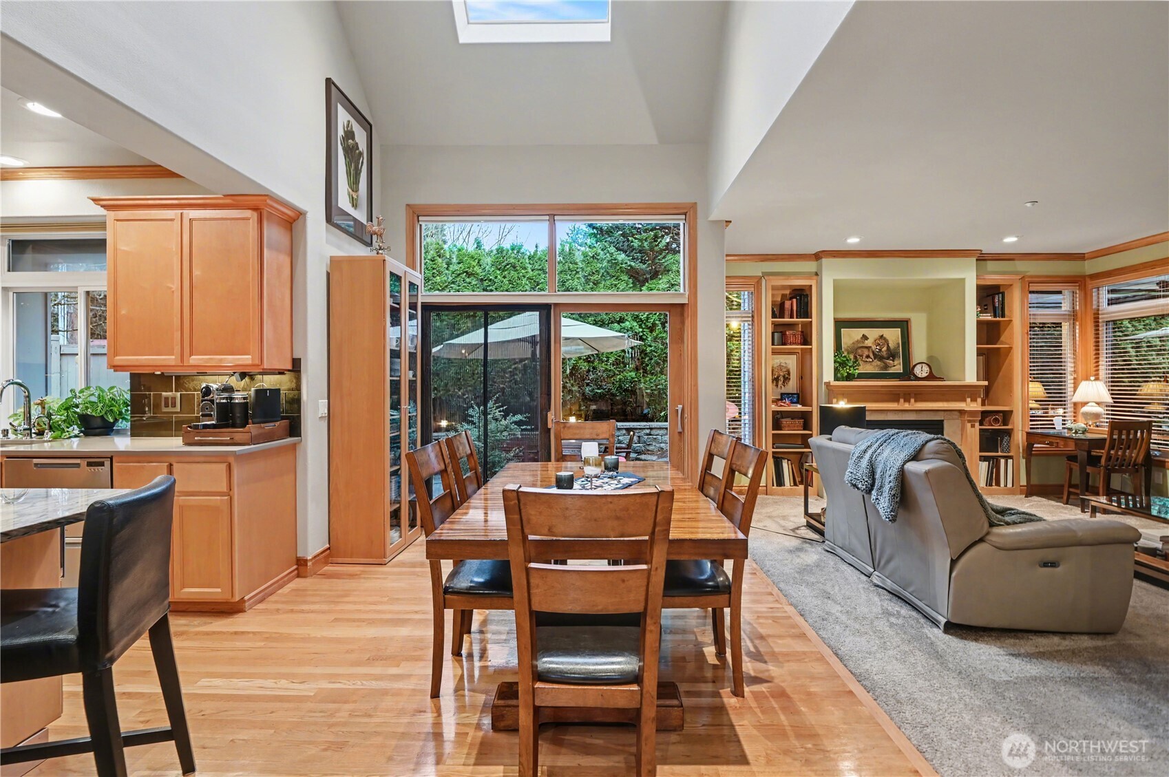 Informal dining area and expansive sliding doors provide easy access to the backyard.