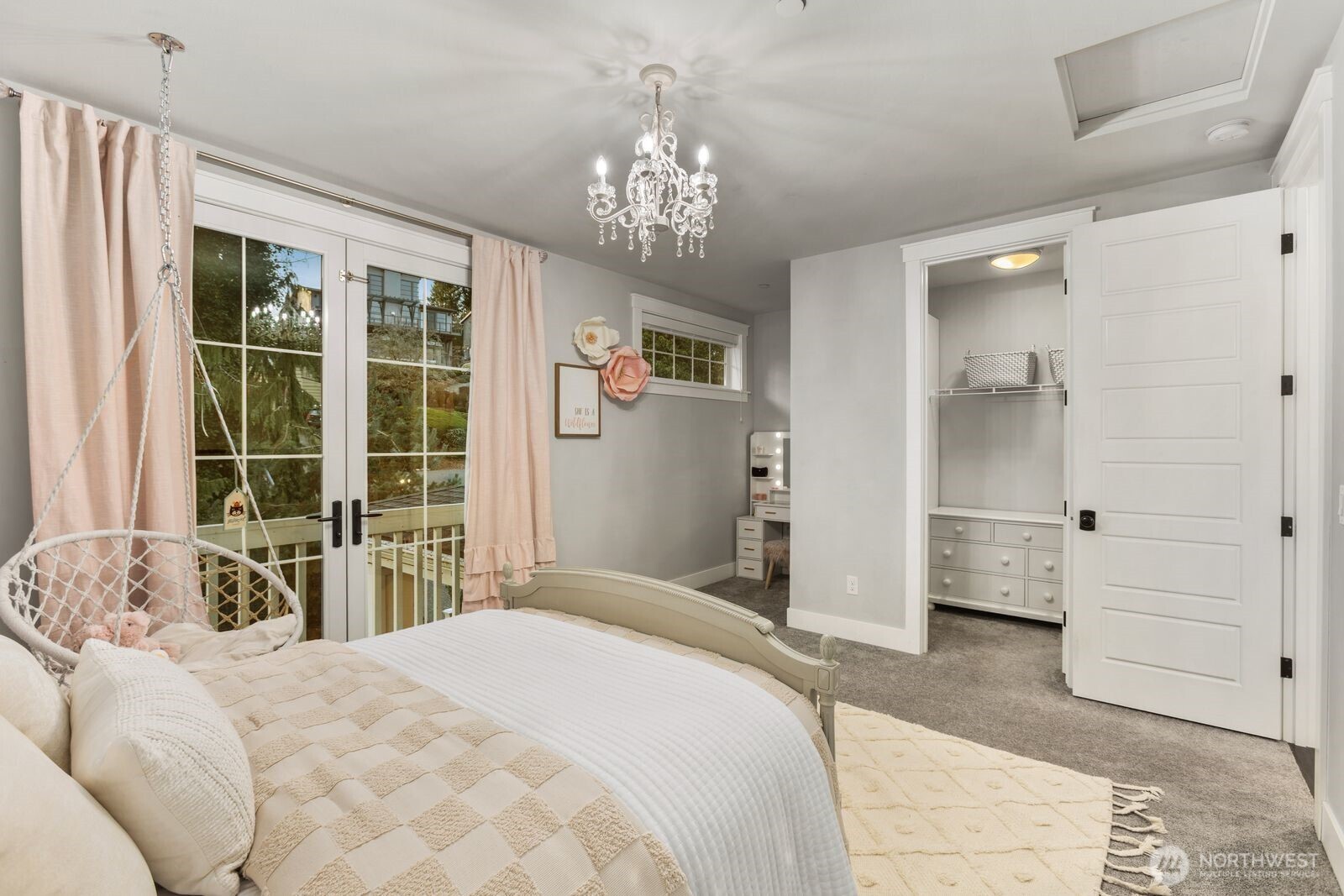Third bedroom featuring a desk nook and walk in closet on upstairs floor