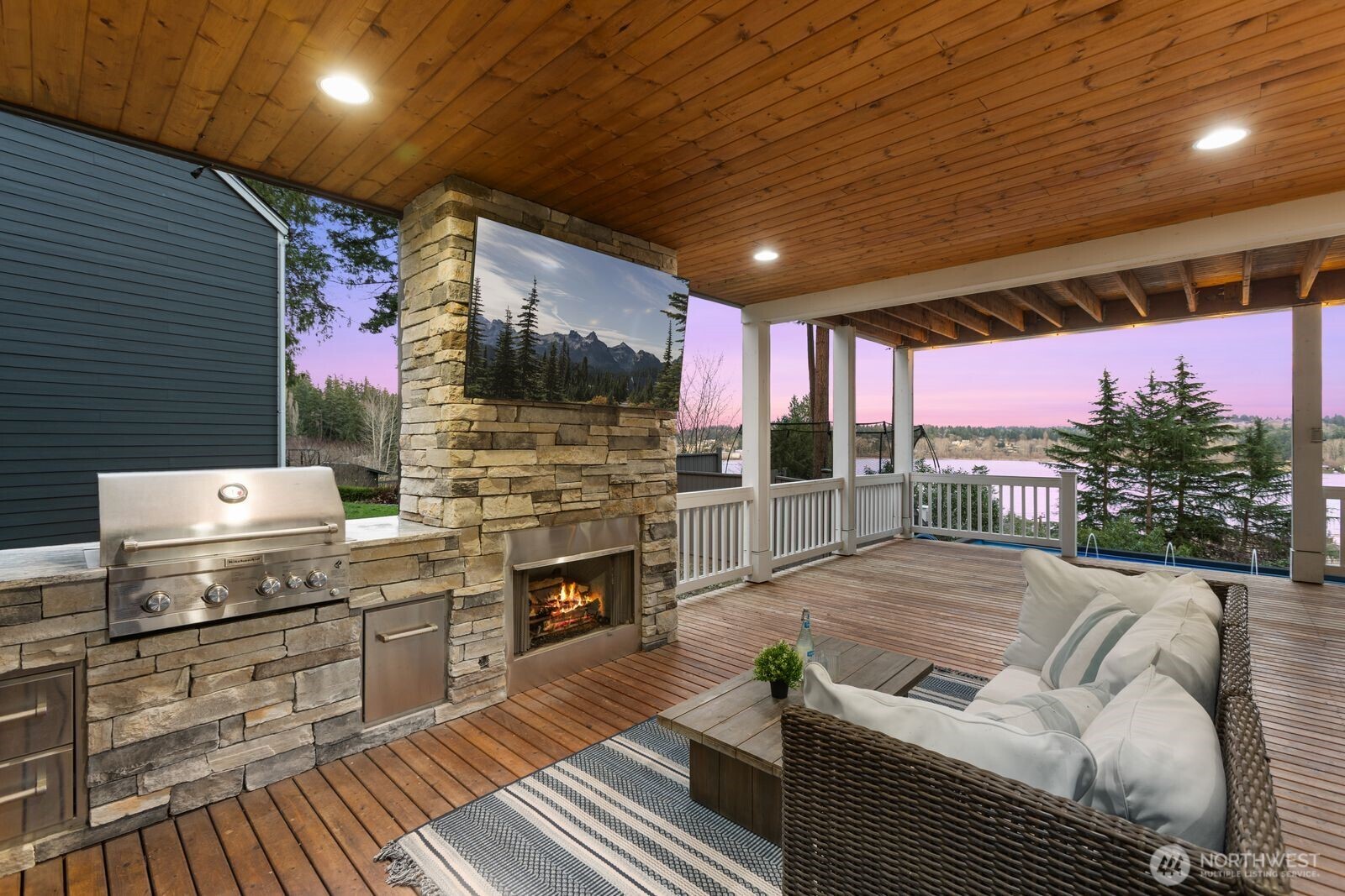 Builtin barbeque and outdoor fire place under covered deck