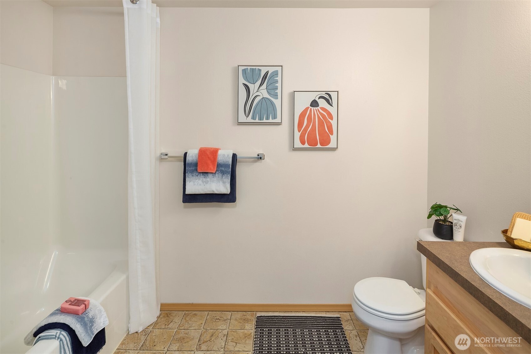 The utilities are conveniently located in the hall bath. Since they are not located in the hall, you can close the bathroom door while doing laundry for a more quiet experience.