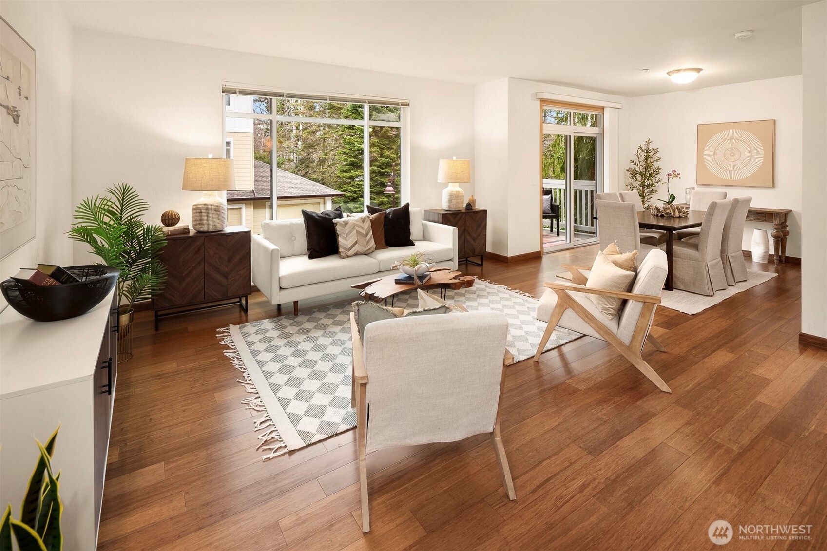 The dining area is large enough to accommodate a full-sized dining room table with comfortable seating for six. The slider opens to the serene private covered deck