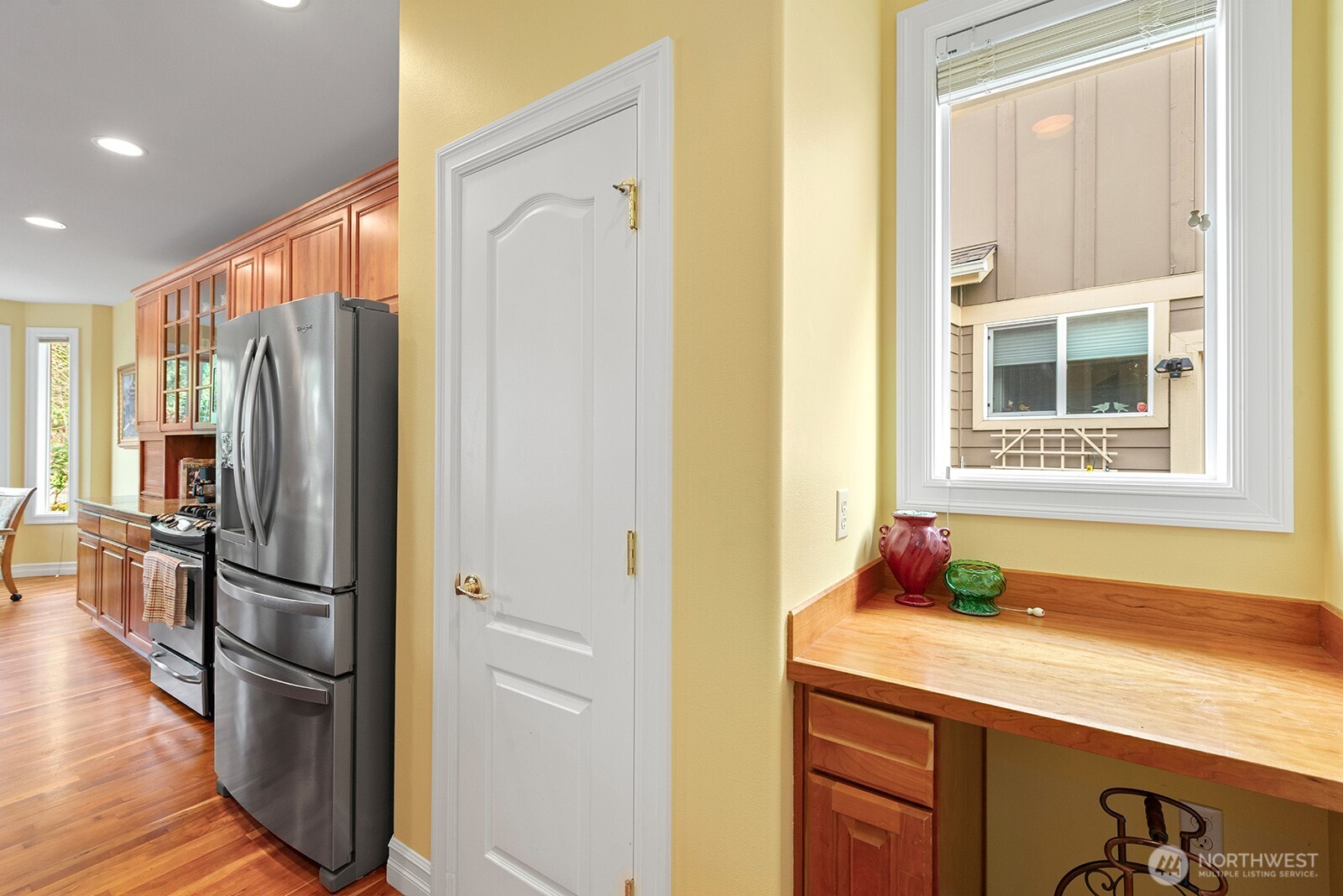 Large Pantry in the Kitchen. To the right is a dedicated space for a Wine Fridge with Counter above.