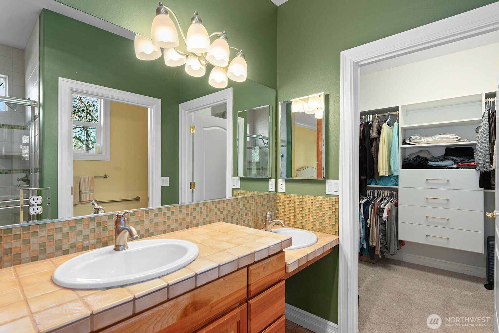 Generous primary bedroom is filled with bright natural light.  An abundance of space which will easily accommodate a king-sized bed plus full-sized furniture.