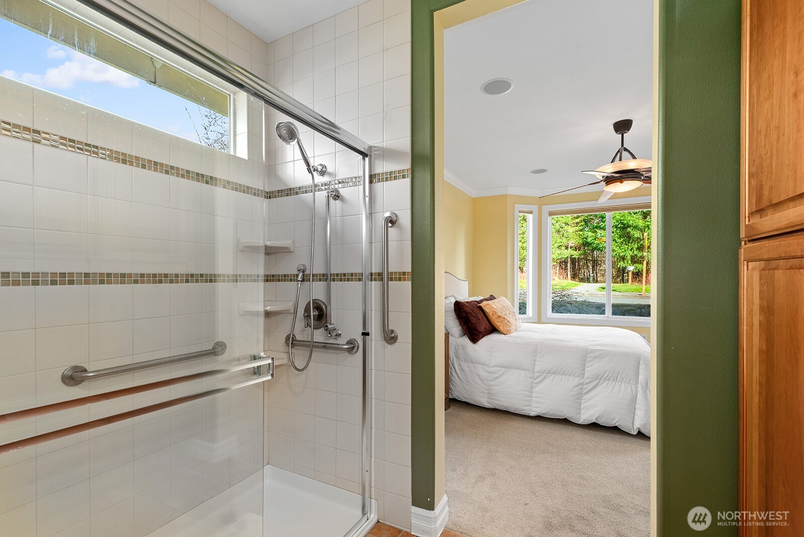 Primary Bedroom with large picture windows and glass door access to Deck.