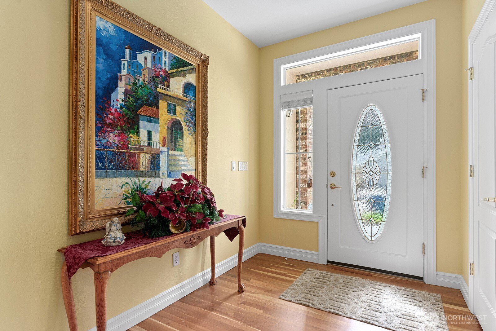 Formal entry.  Beautiful Hardwood floors throughout the living spaces.