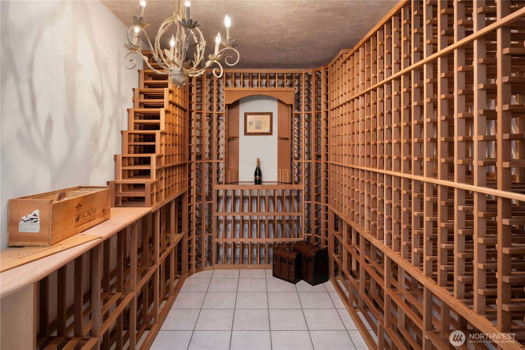 The temperature-controlled wine cellar is wrapped in rich cedar, offering an aromatic, old-world ambiance.