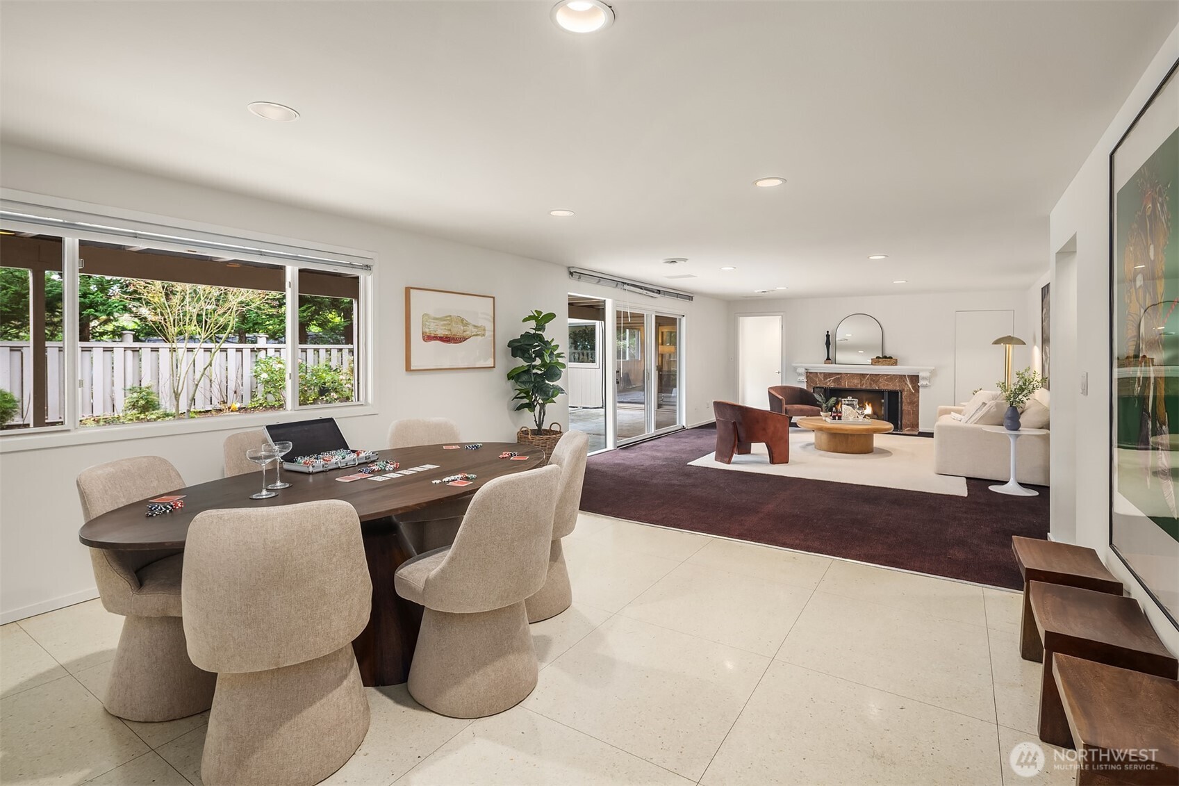 The garden level is light-filled and surprisingly spacious, with four bedrooms, a bonus and game room, and an office — generous room to write a beautiful life story.