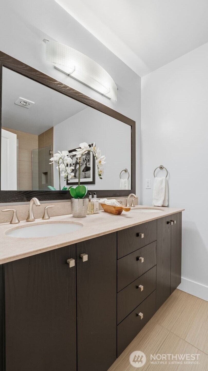 Primary suite attached bath with frameless walk-in shower