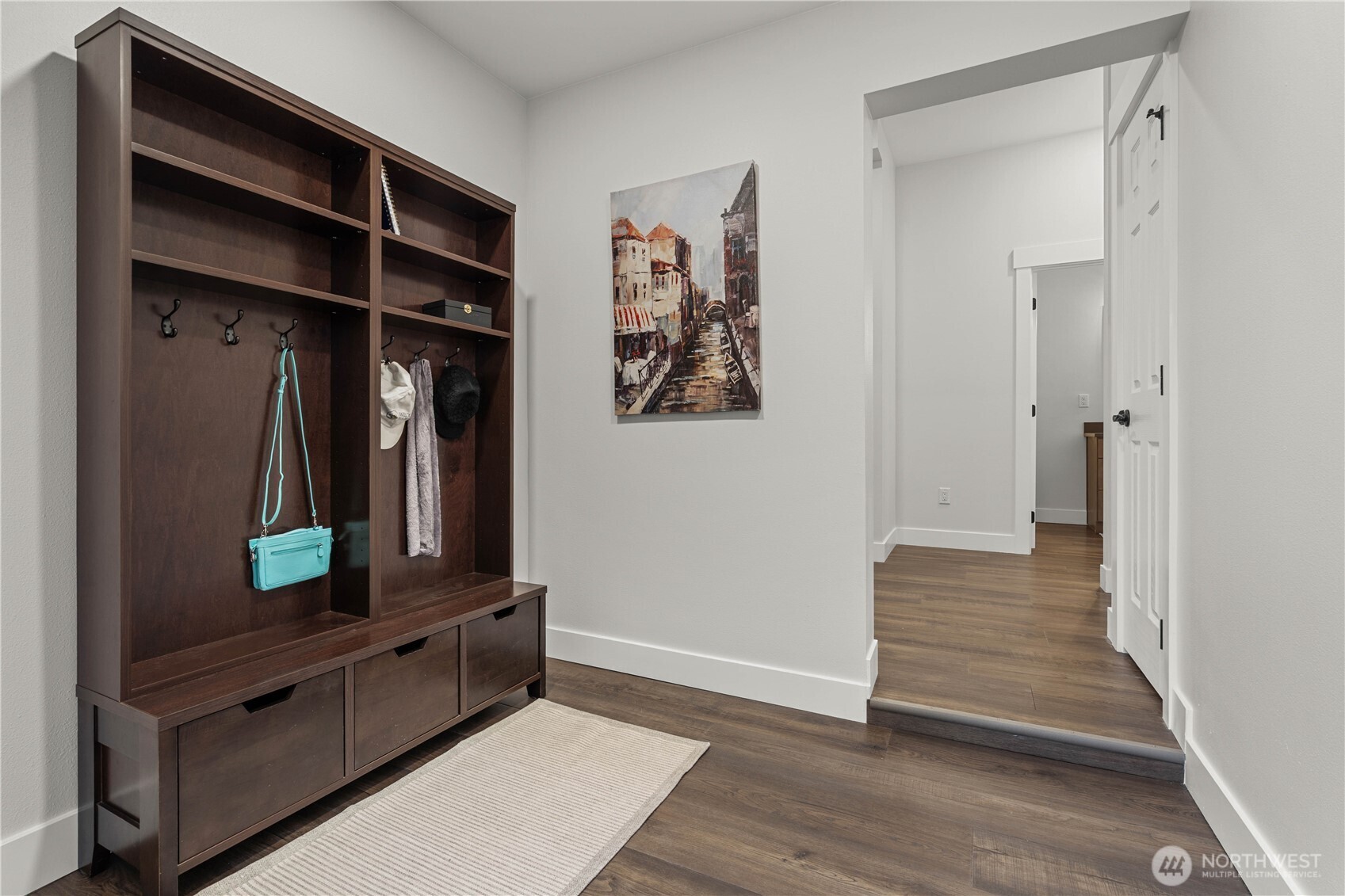 Off N Lawrence, Enter into a convenient Mud Room. Perfect spot to drop shoes, coats, backpacks. Massive Closet to the Right offers plenty of storage options. (Not shown in photo). Straight ahead is the Powder Room.