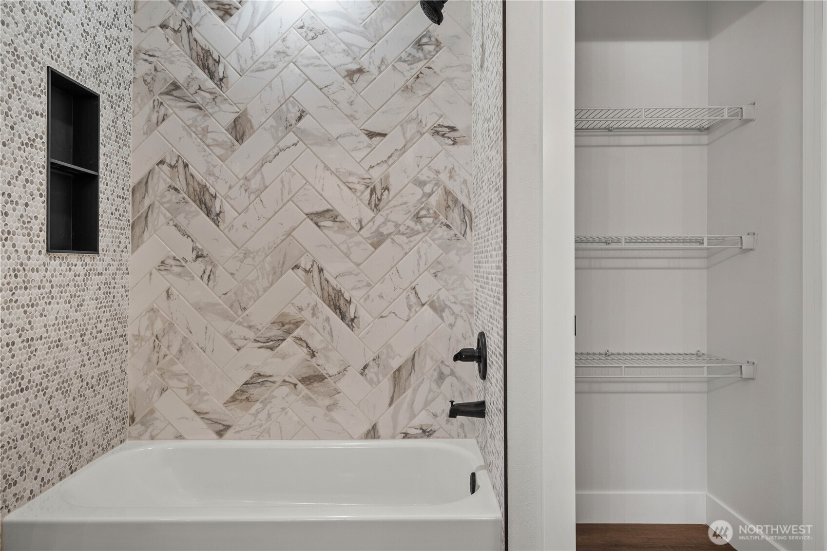 Main Hall Bath Shower w/Custom Tile and Black Accents. Linen Shelving is already in place!