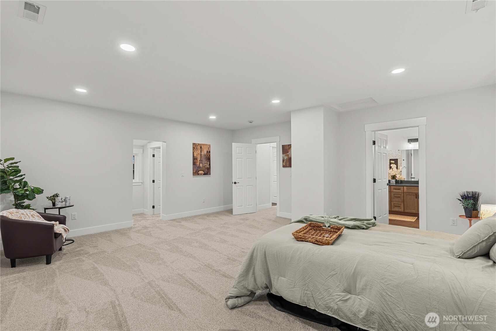Primary Bedroom showing the Closet Hallway to the Left and En Suite Bath to the Right.