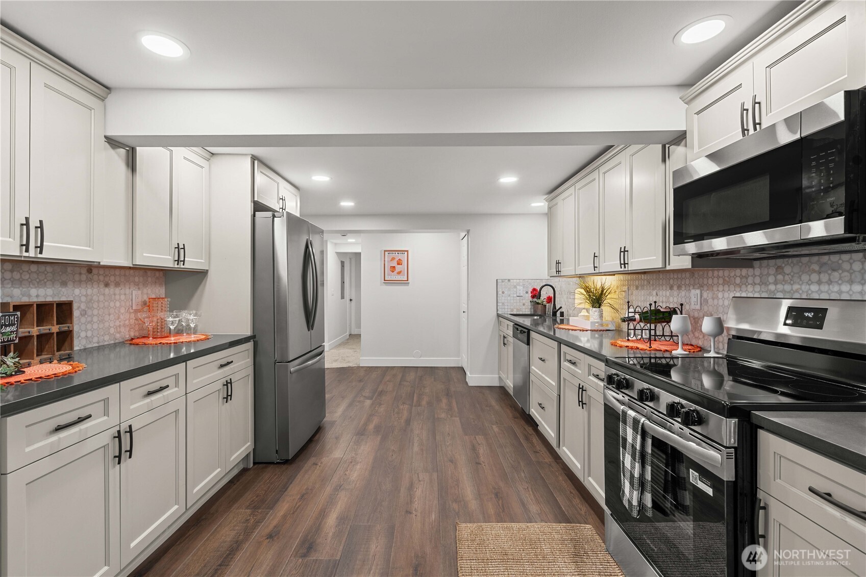 Large Kitchen w/New Cabinets and Full Custom Tile Backsplash and Stainless Appliances.