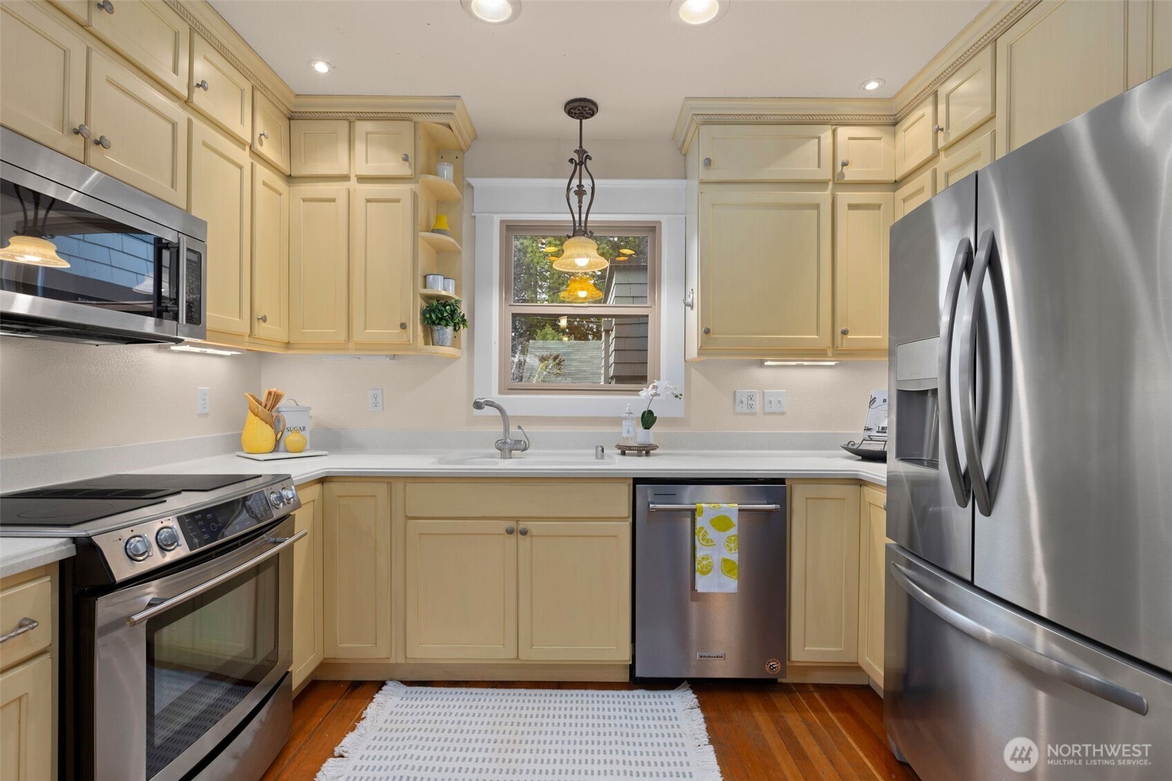 With custom cabinetry and stainless appliances