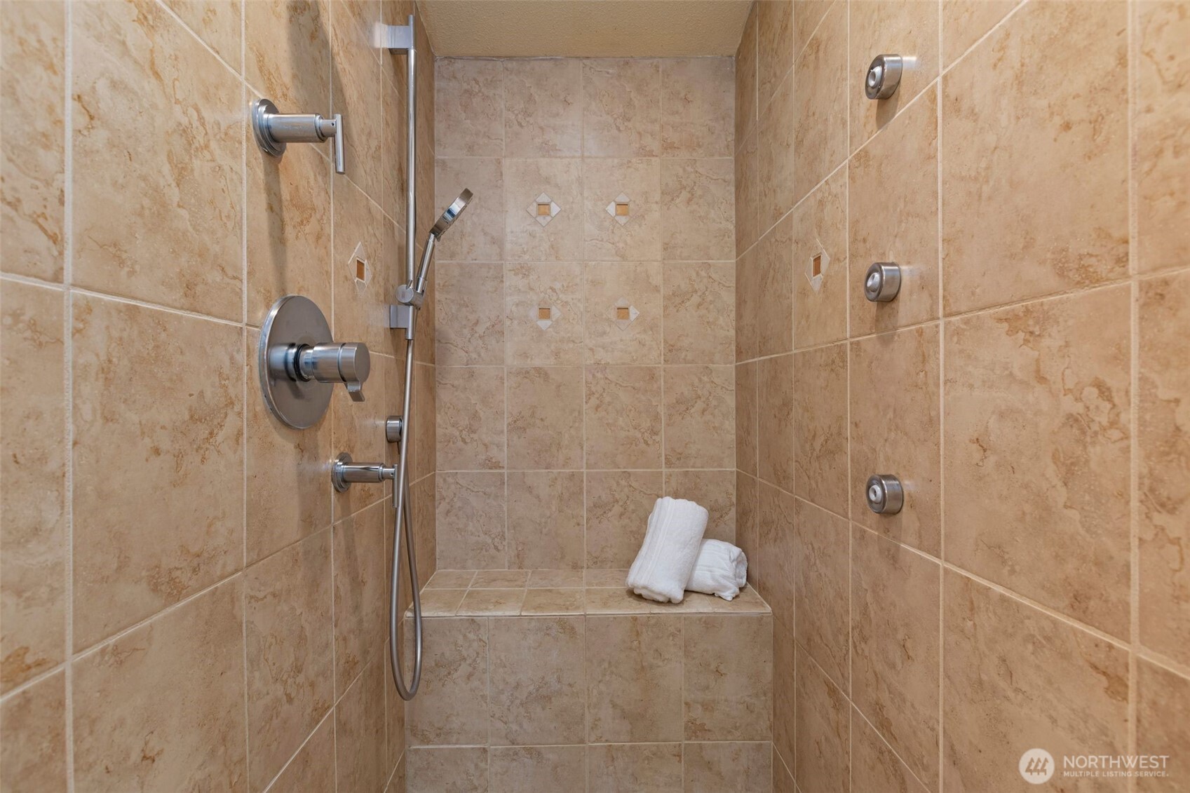 Check out this shower with the multi-head shower system.