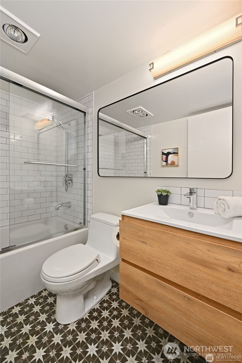 Beautiful tile flooring in the renovated bath