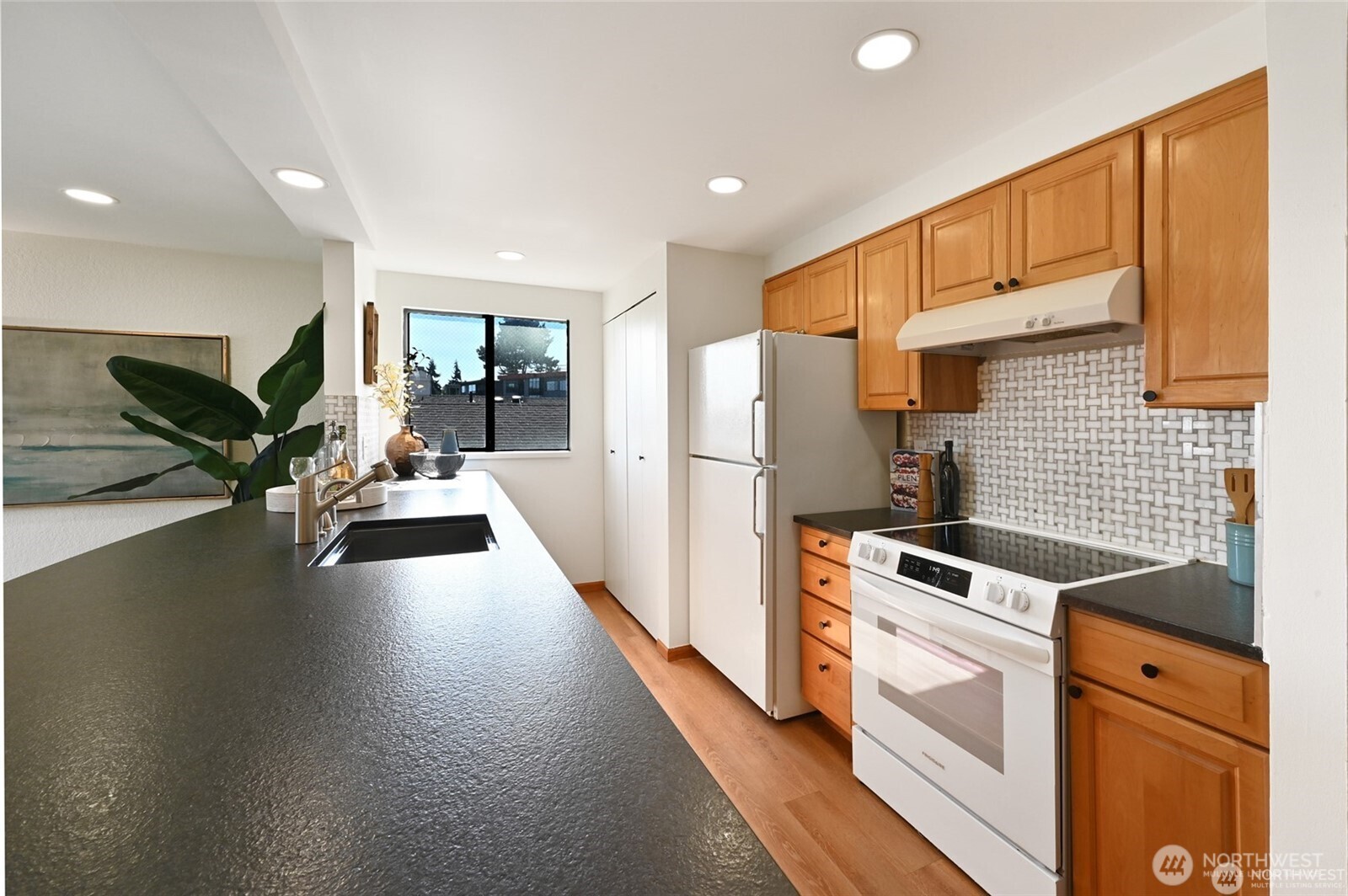 Honed granite counters and tile backsplashes for beauty and classic quality.