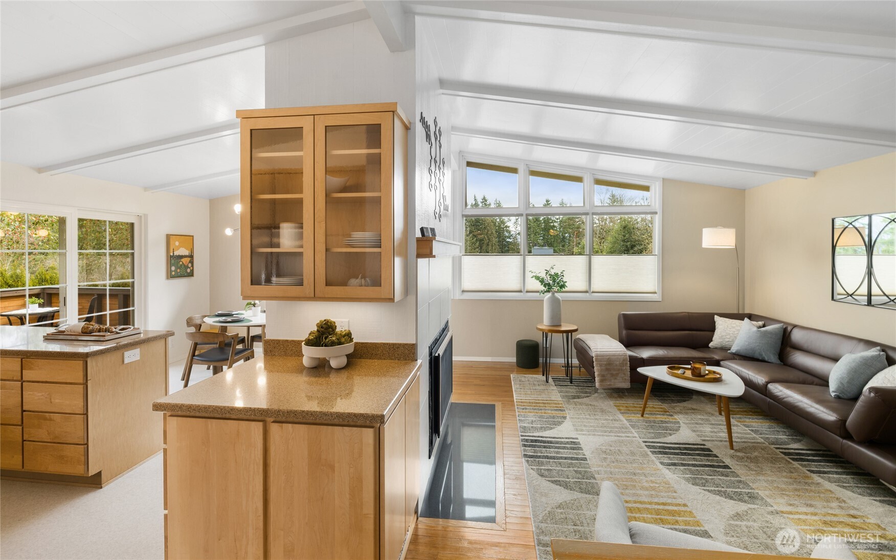 Living/dining area offers abundance of natural lighting