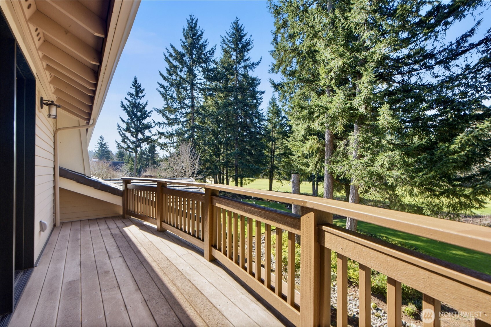 MASTERBEDTOOM WITH FRECNCH DOOR OPEN TO BALCONY OVERLOOKING GOLF COURSE