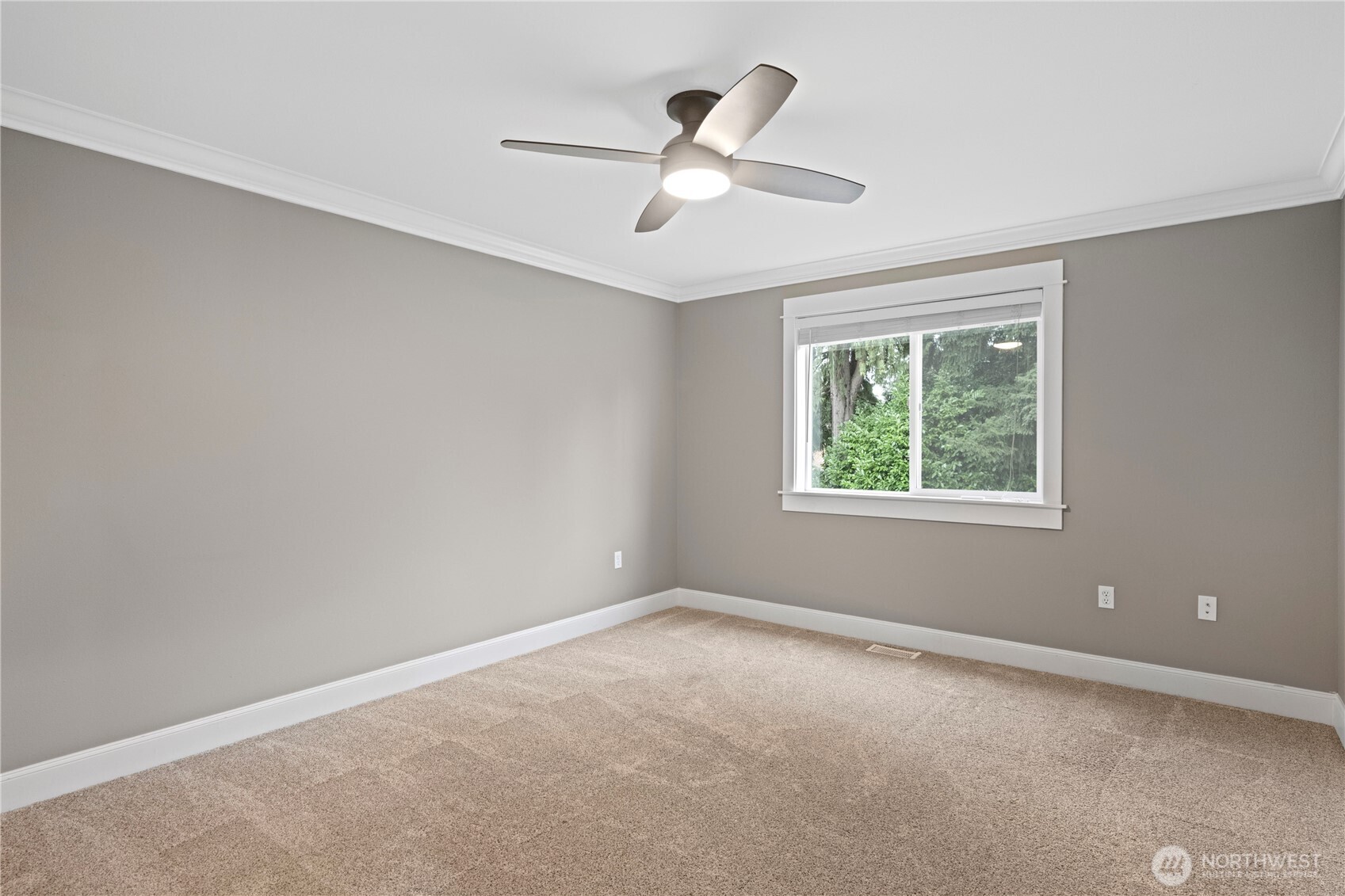 Here is the second bedroom on the upper level.  Ceiling fan with light and views to the back yard.
