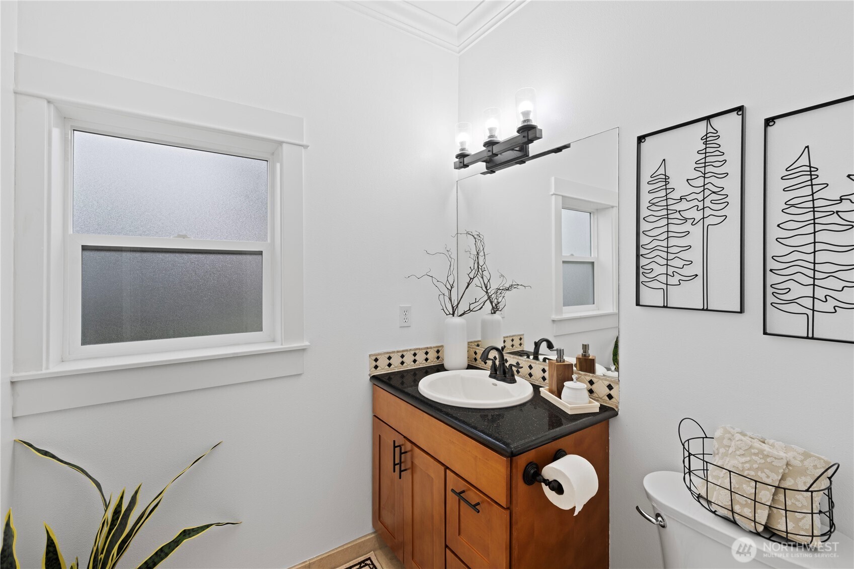One of two upper level bedroom with views to the front of the home.