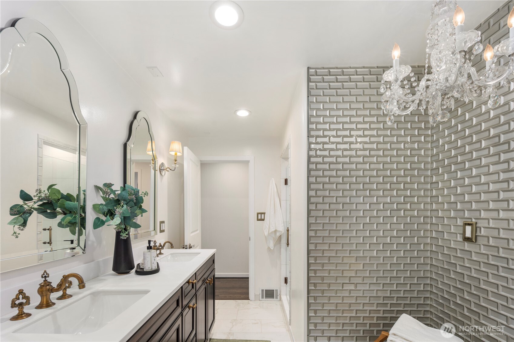 Luxurious guest bath on the main level offers a serene retreat that may make your guests never want to leave.