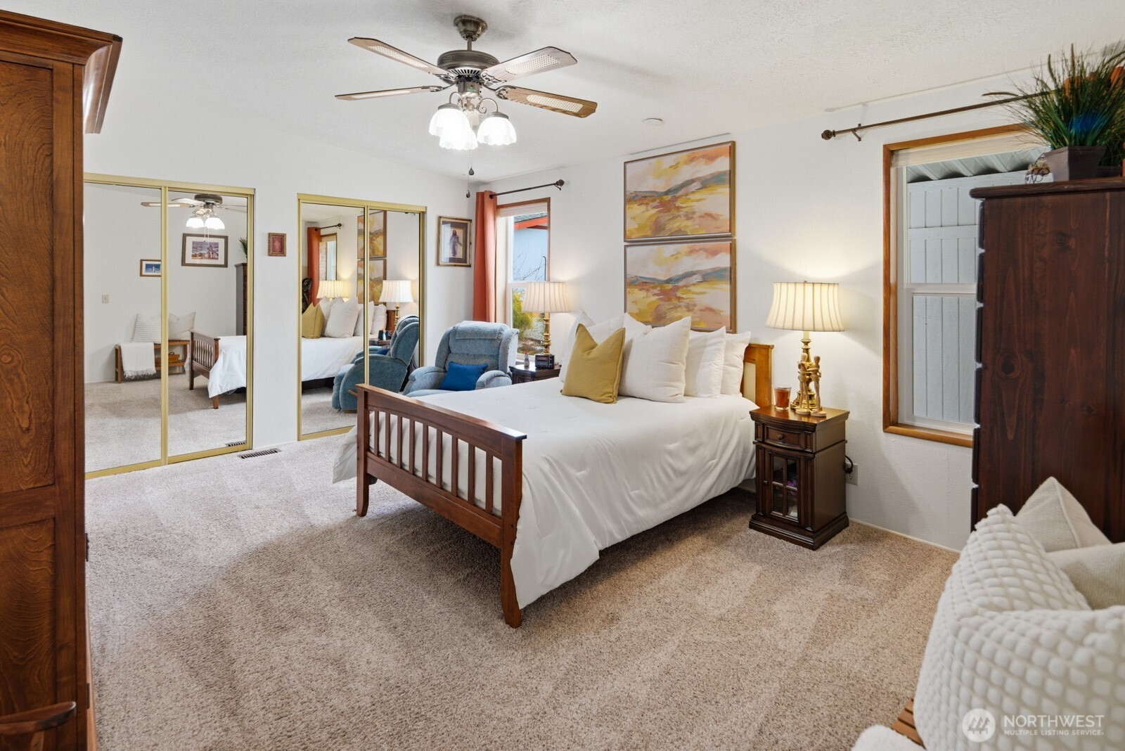 Luxurious primary bedroom boasts two large closets and a beautifully updated ensuite 5-piece bathroom